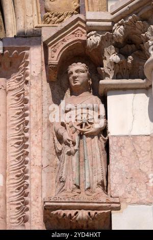 Saint Catherine of Alexandria, statue on Facade of Sant`Anastasia Church in Verona, Italy Stock Photo